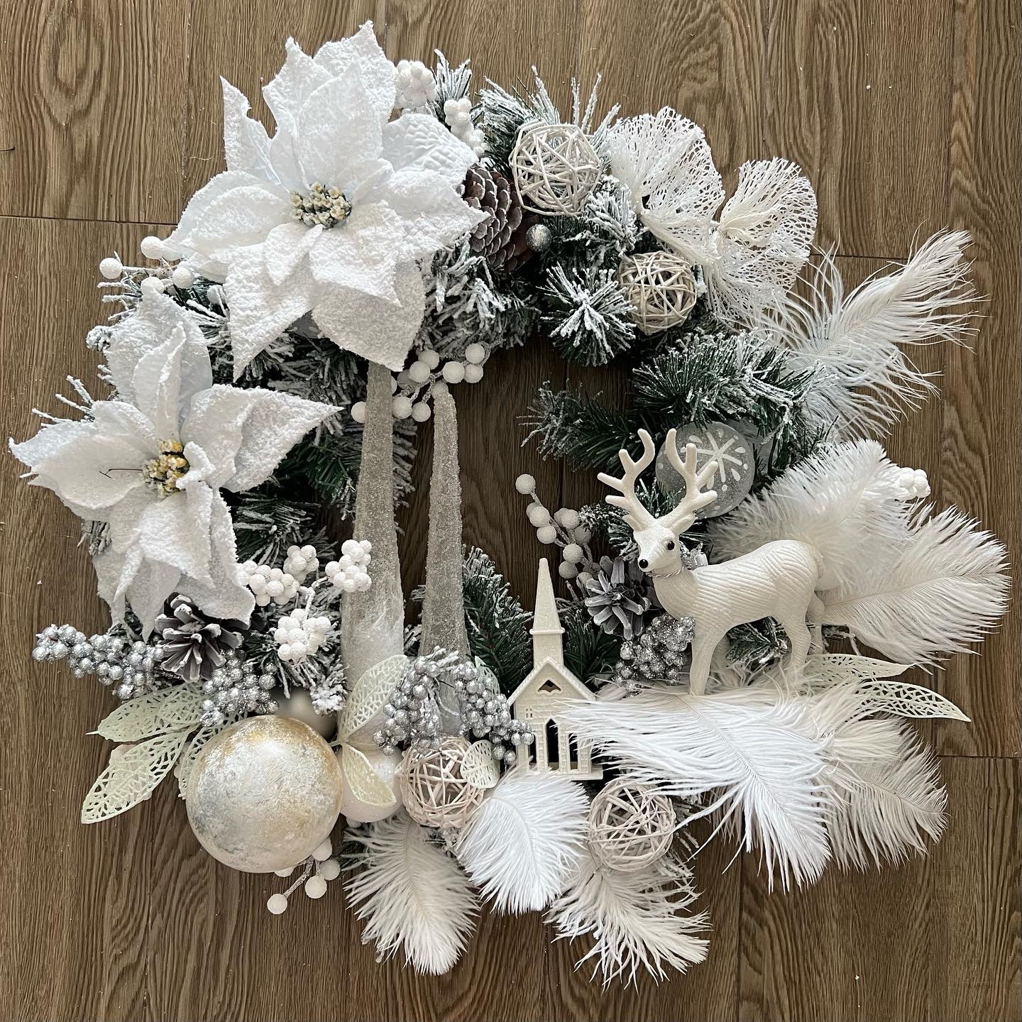 White winter wreath with Ferns and Poinsettias