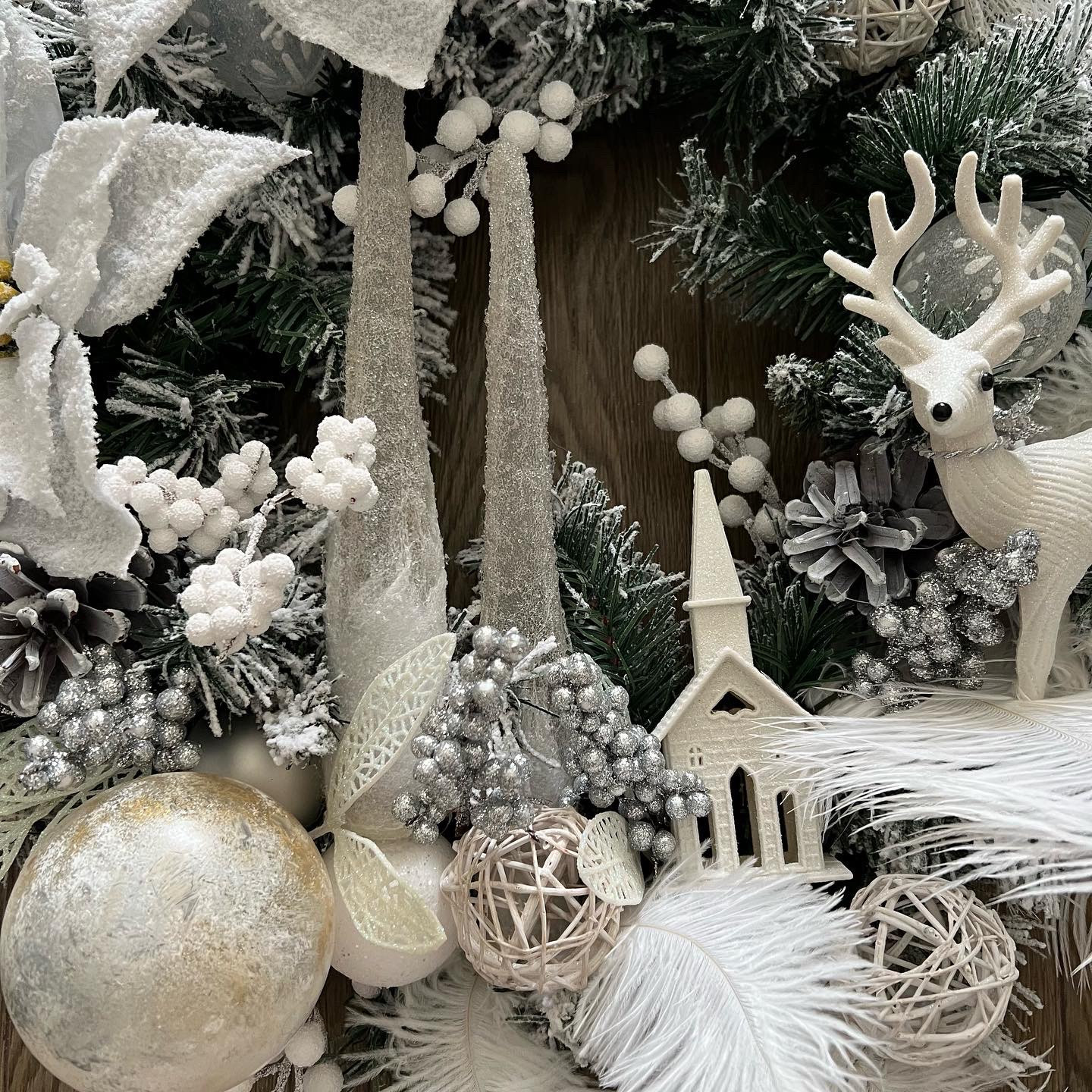 White winter wreath with Ferns and Poinsettias