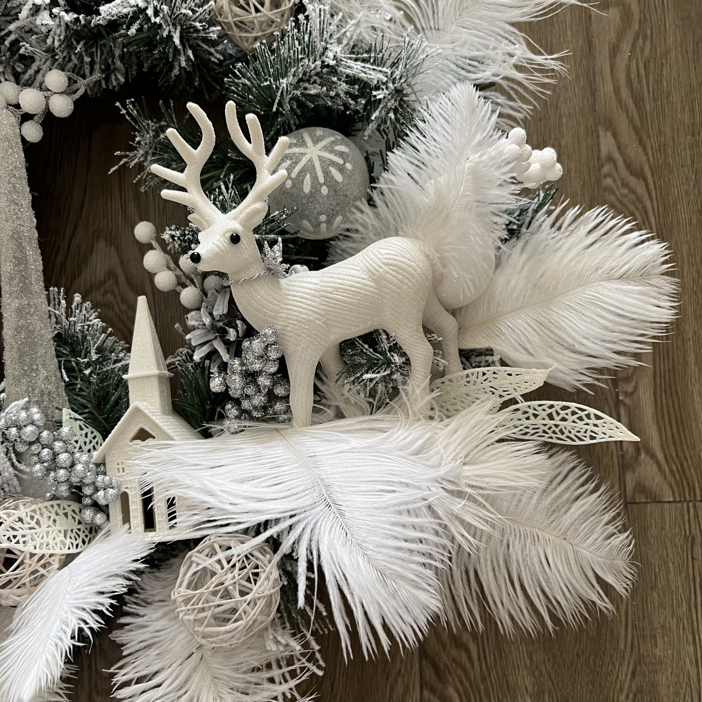 White winter wreath with Ferns and Poinsettias