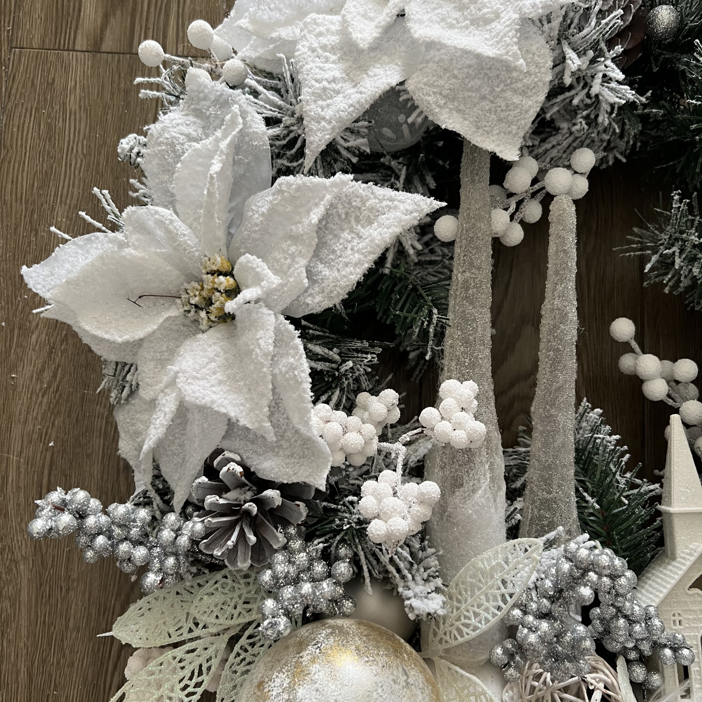 White winter wreath with Ferns and Poinsettias