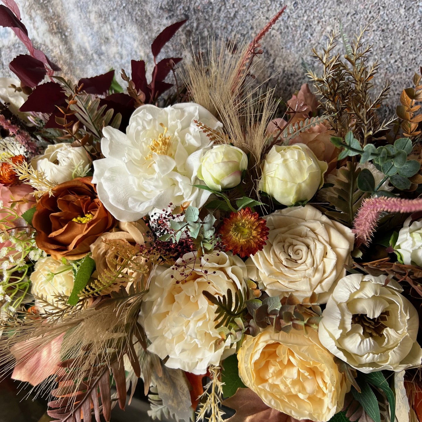Thanksgiving table centrepiece with artificial flowers