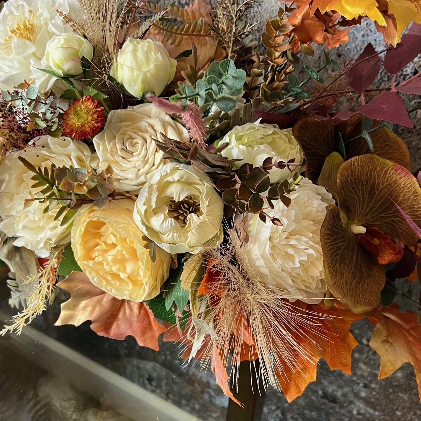 Thanksgiving table centrepiece with artificial flowers