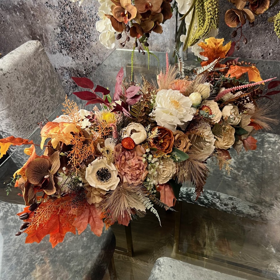 Thanksgiving table centrepiece with artificial flowers