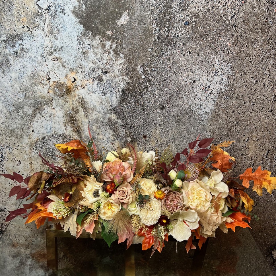 Thanksgiving table centrepiece with artificial flowers