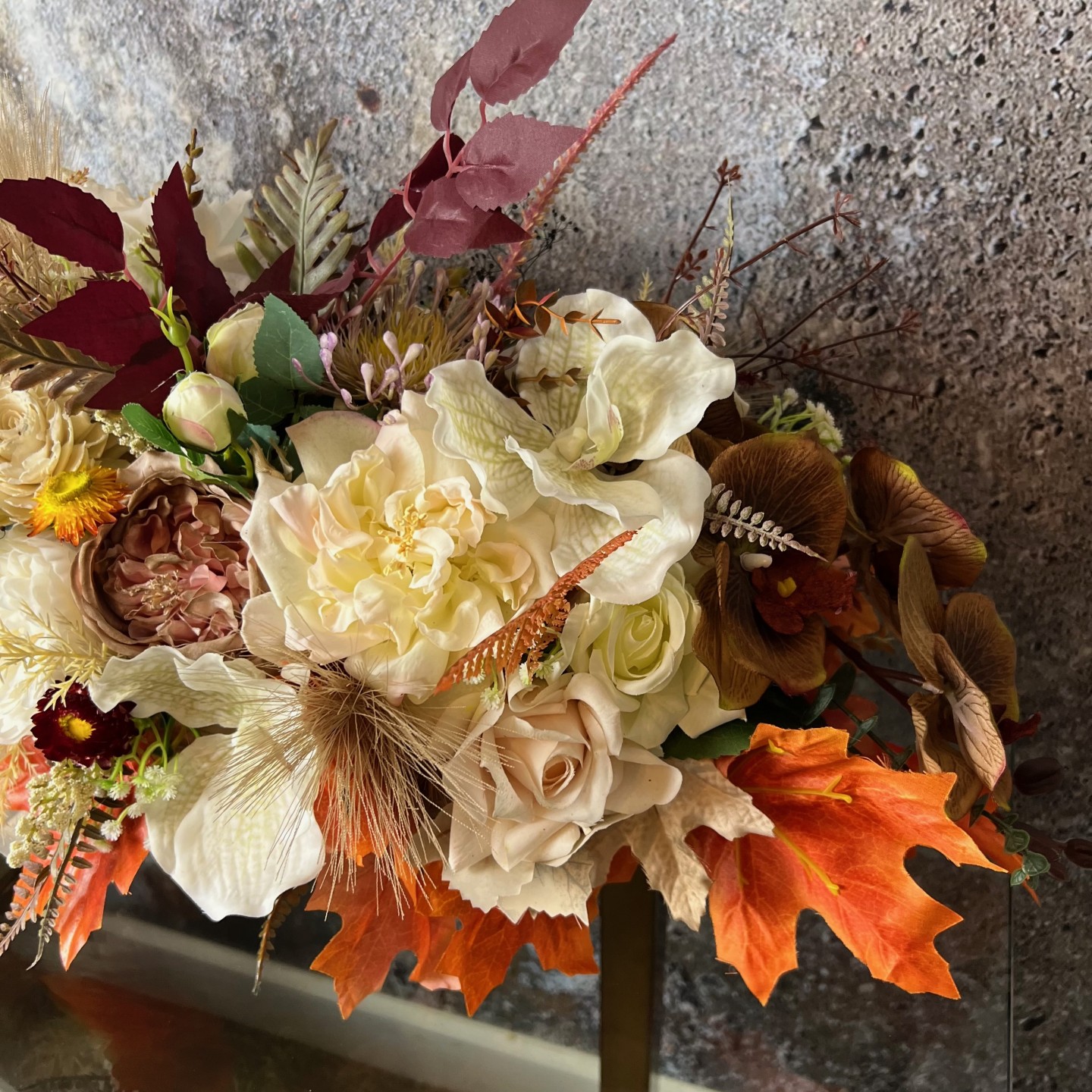 Thanksgiving table centrepiece with artificial flowers
