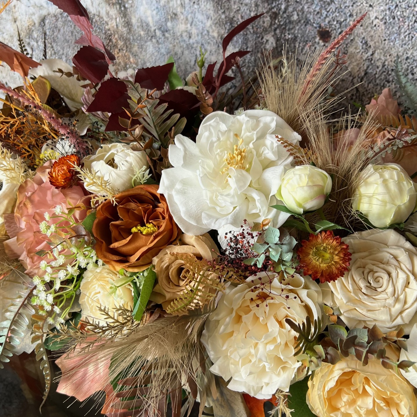 Thanksgiving table centrepiece with artificial flowers