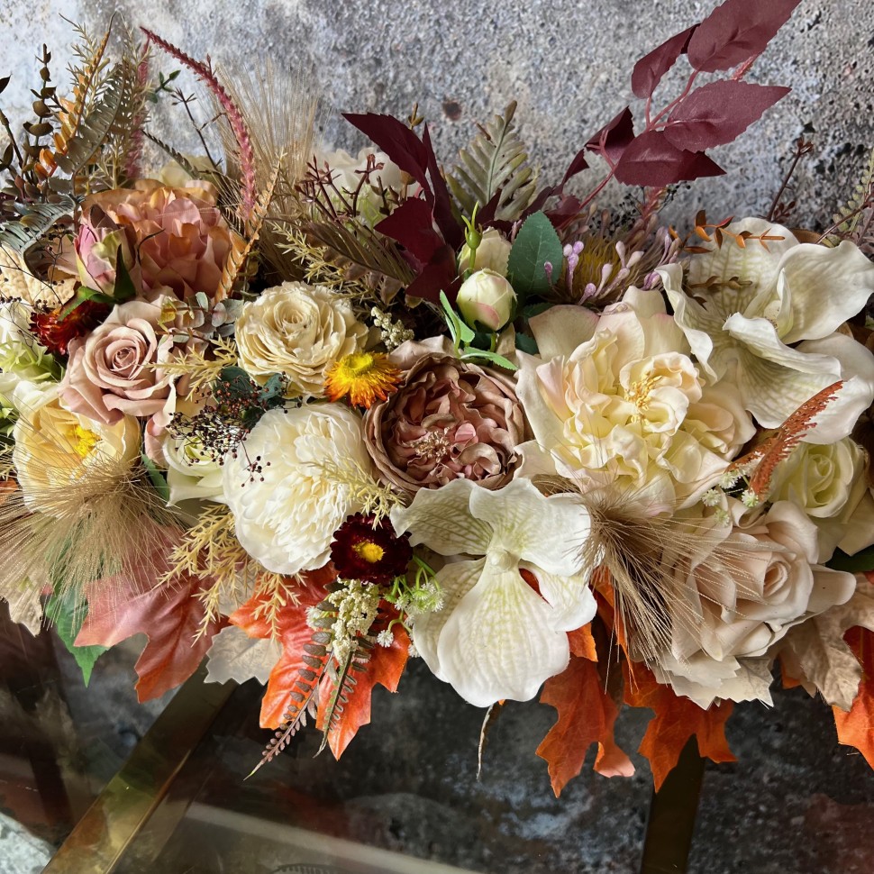 Thanksgiving table centrepiece with artificial flowers
