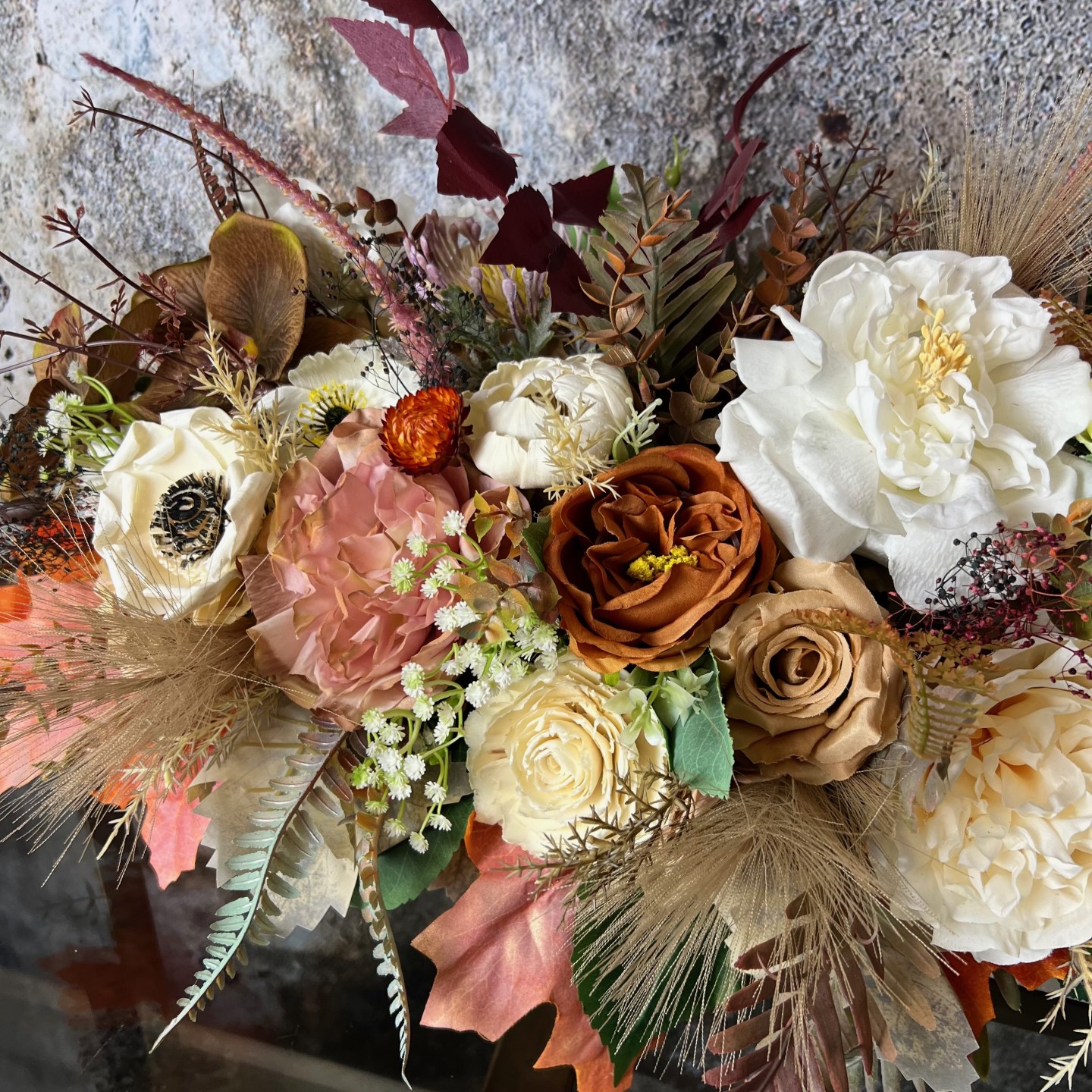 Thanksgiving table centrepiece with artificial flowers