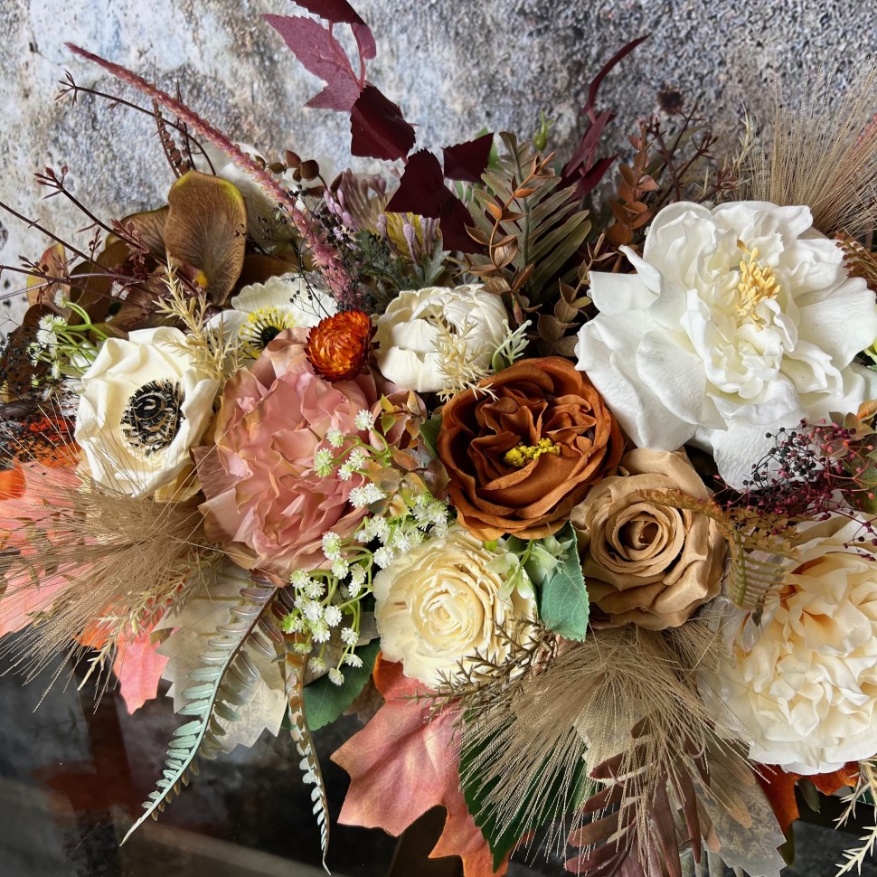 Thanksgiving table centrepiece with artificial flowers