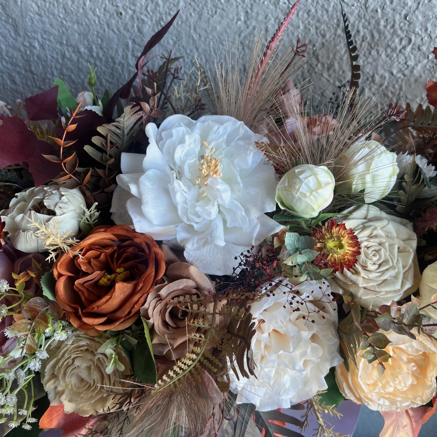 Thanksgiving table centrepiece with artificial flowers