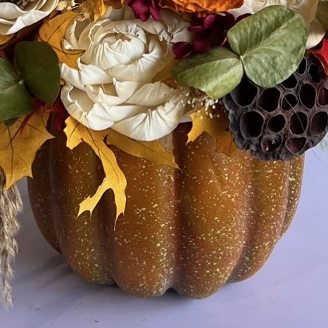 Thanksgiving arrangement in a pumpkin with preserved flowers