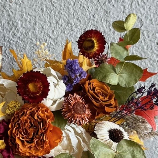 Thanksgiving arrangement in a pumpkin with preserved flowers