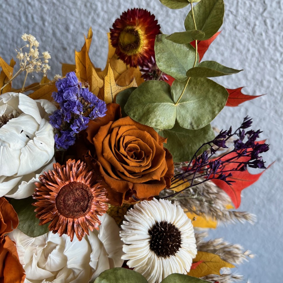 Thanksgiving arrangement in a pumpkin with preserved flowers