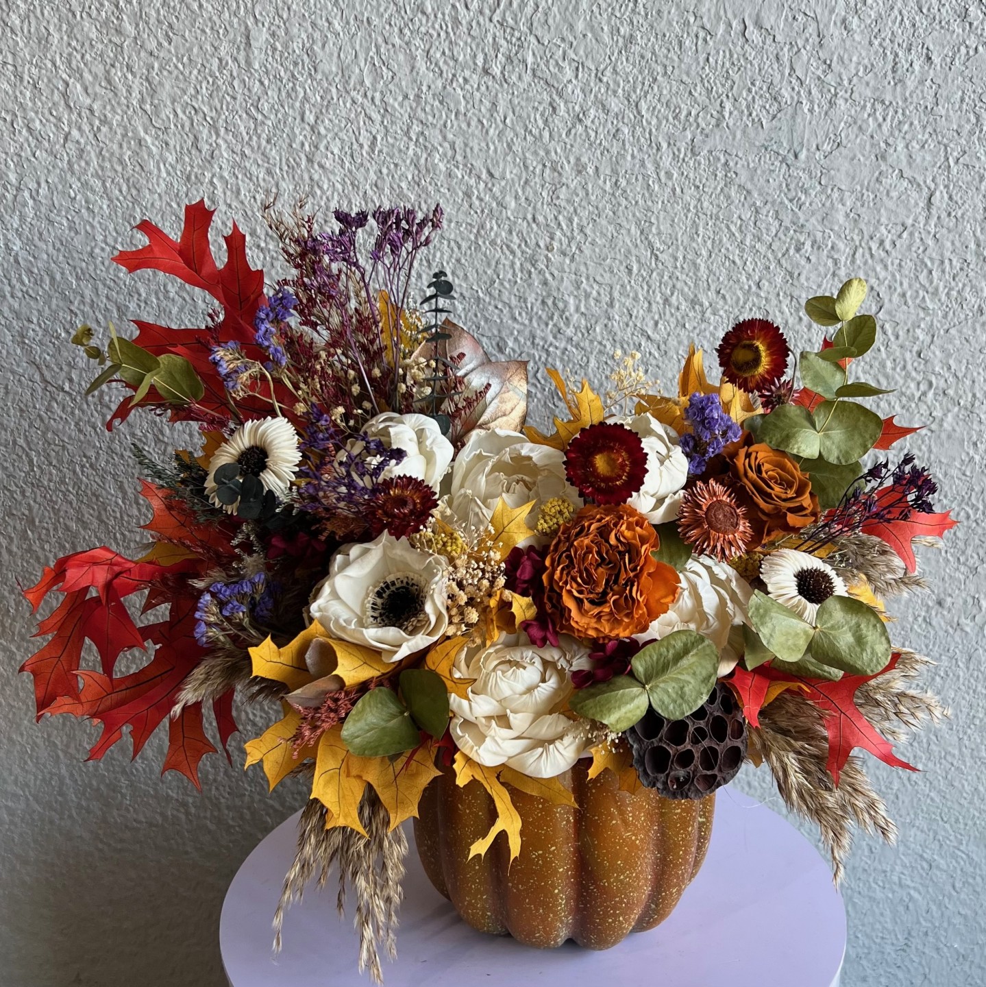 Thanksgiving arrangement in a pumpkin with preserved flowers Thanksgiving arrangement in a pumpkin with preserved flowers