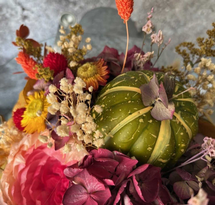 Thanksgiving arrangement with preserved flowers in iron car