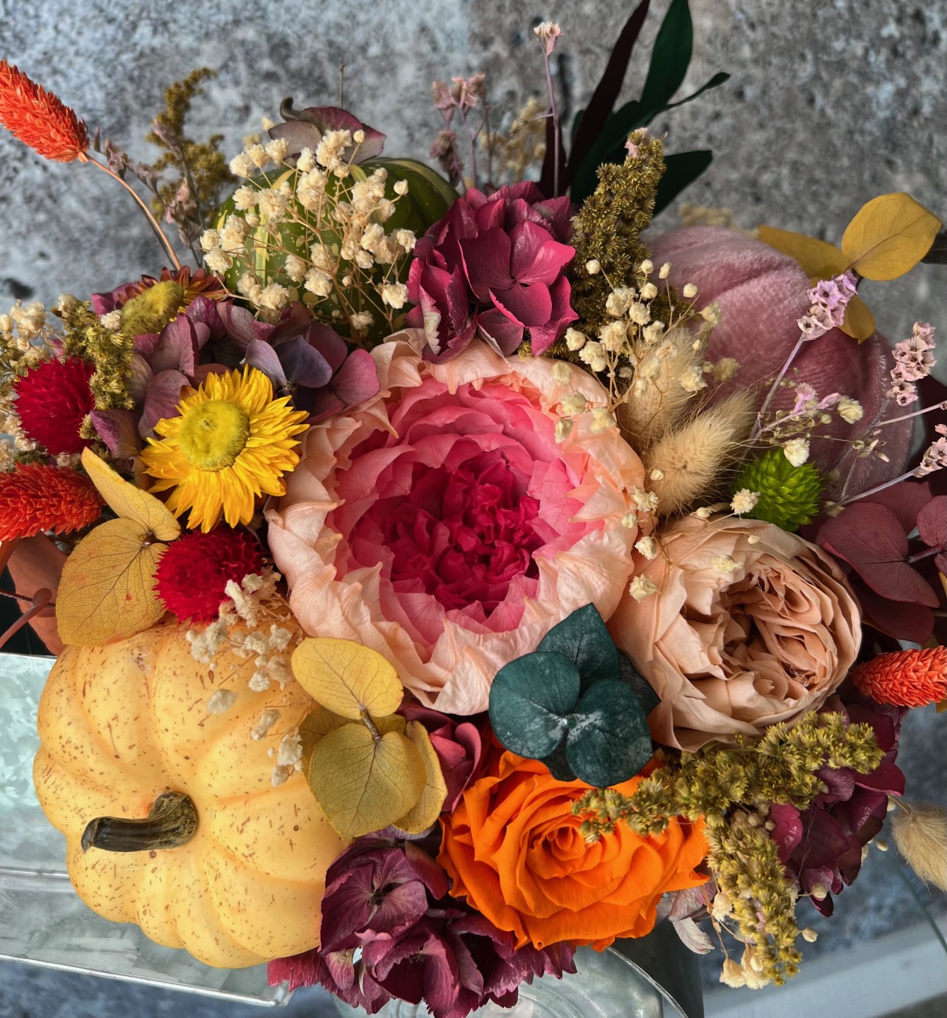 Thanksgiving arrangement with preserved flowers in iron car