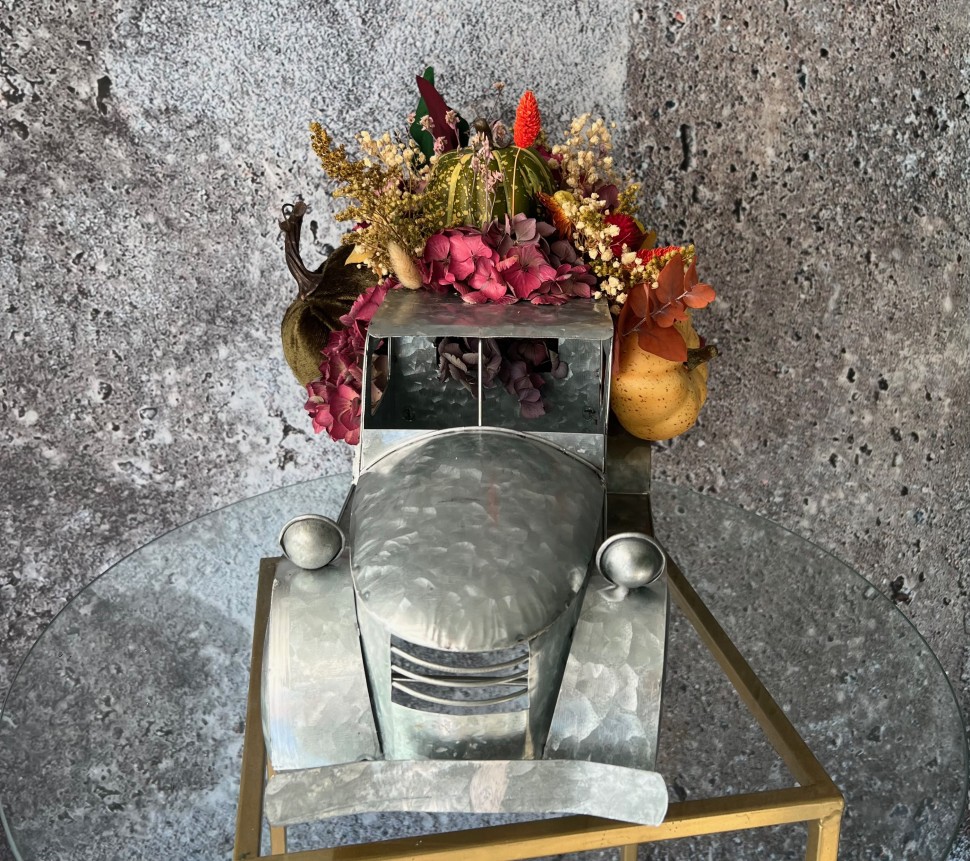 Thanksgiving arrangement with preserved flowers in iron car
