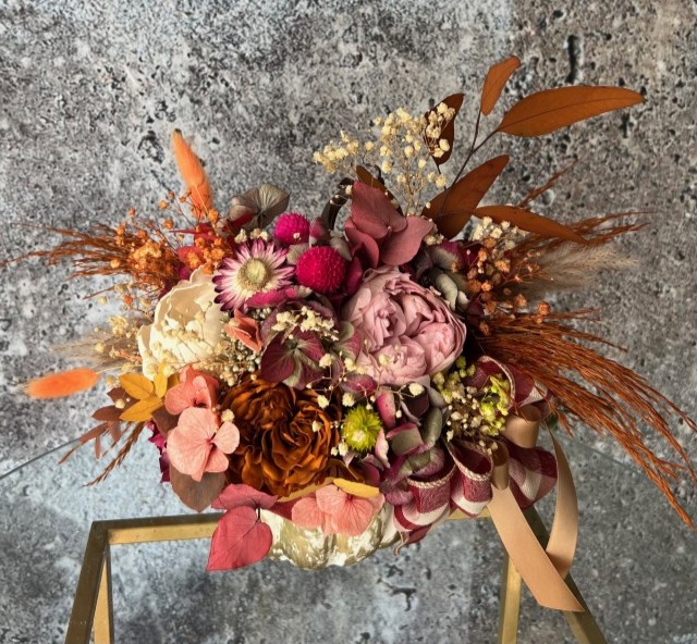 Thanksgiving arrangement with preserved flowers in gold pumpkin