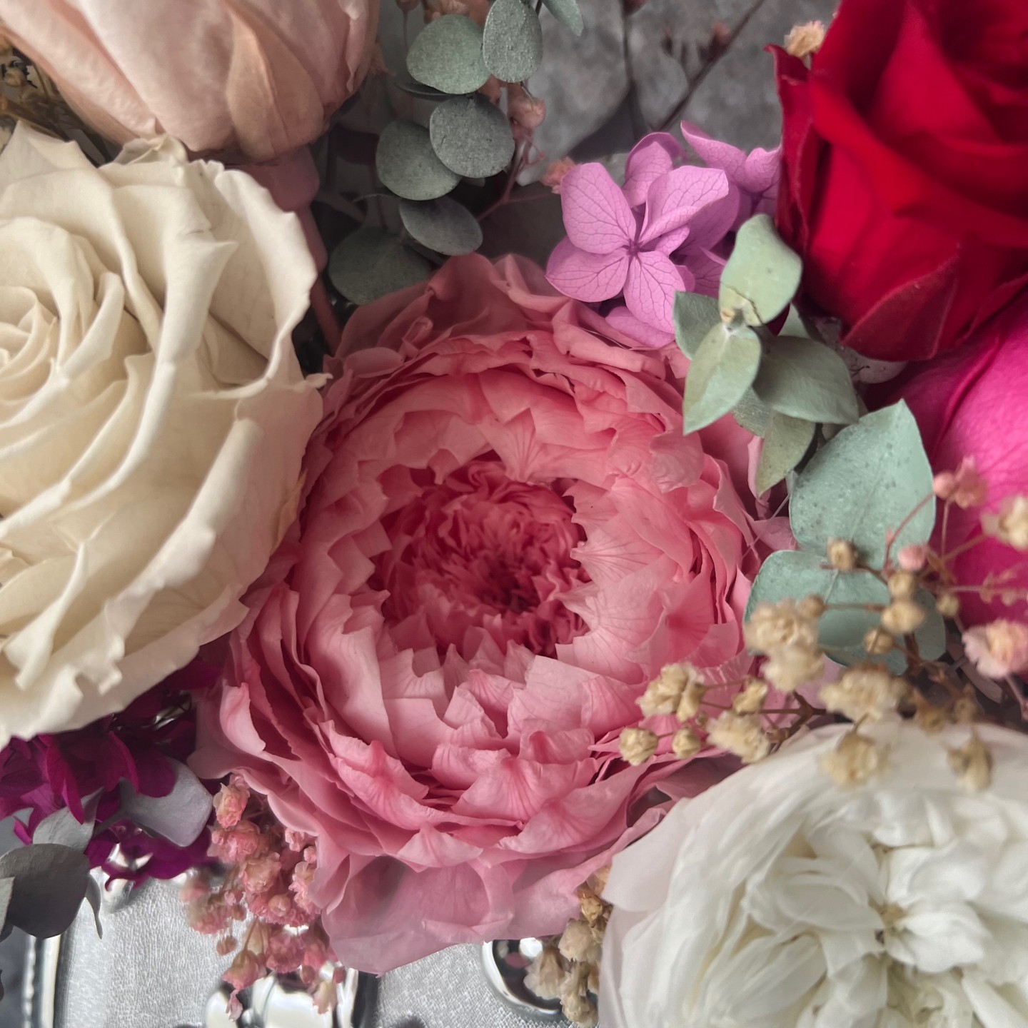 Silver bag vase with preserved flowers Silver bag vase with preserved flowers