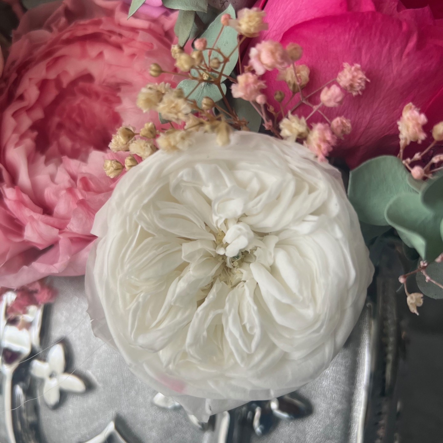 Silver bag vase with preserved flowers Silver bag vase with preserved flowers