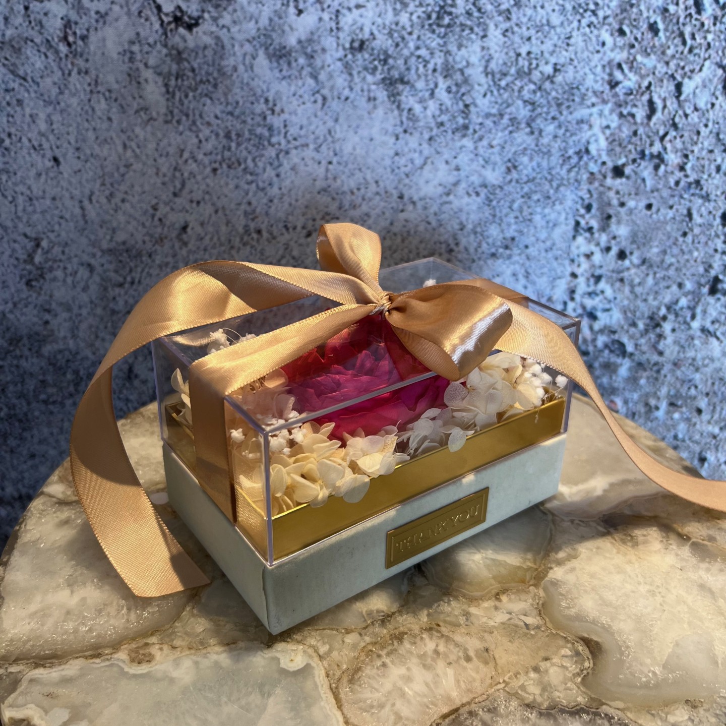 Single preserved hot pink peony in acrylic box